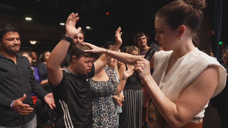 Krick places a supposedly healing hand on a follower. 