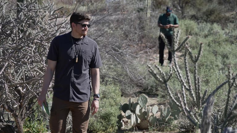 Law enforcement agents check vegetation areas around Nancy Guthrie’s home in Tucson.