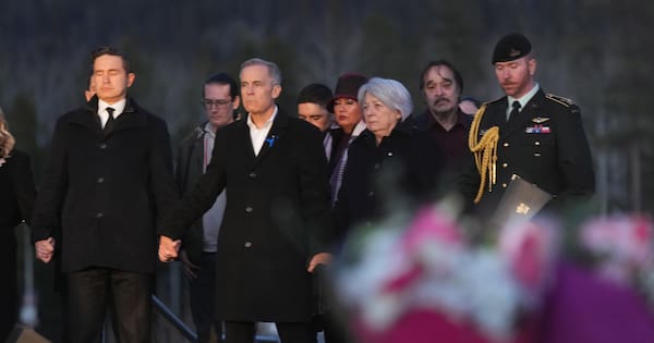 PM Carney and opposition leader hold hands at school shooting vigil
