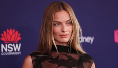 Margot Robbie Goes Full Goth With Only a Sheer Layer of Black Fabric Over Bra