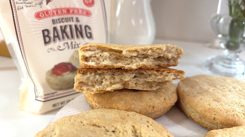 Close-up of biscuit cut in half, baking mix bag behind