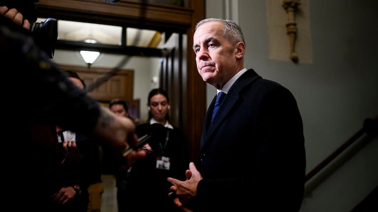Prime Minister Mark Carney speaks to reporters ahead of a caucus meeting on Parliament Hill in Ottawa.
