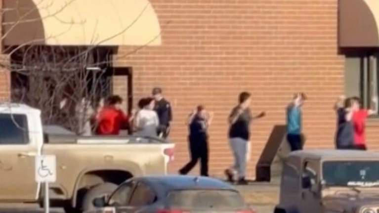 This grab from video shows students exiting the Tumbler Ridge school after deadly shootings, in British Columbia, Canada.