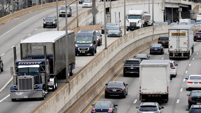 Motor vehicle traffic moves along the Interstate 76 highway in Philadelphia, March 31, 2021.