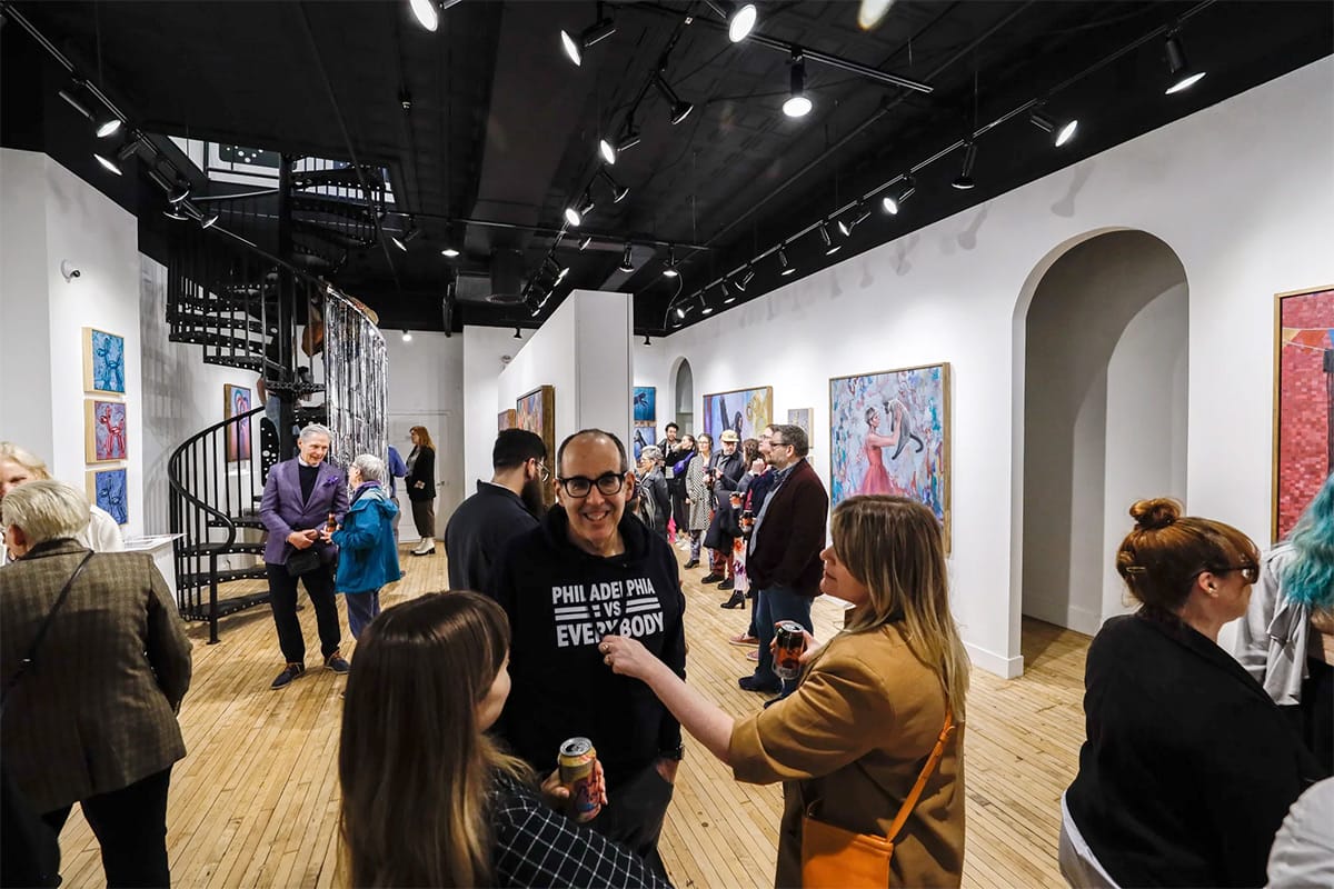 people standing in a gallery