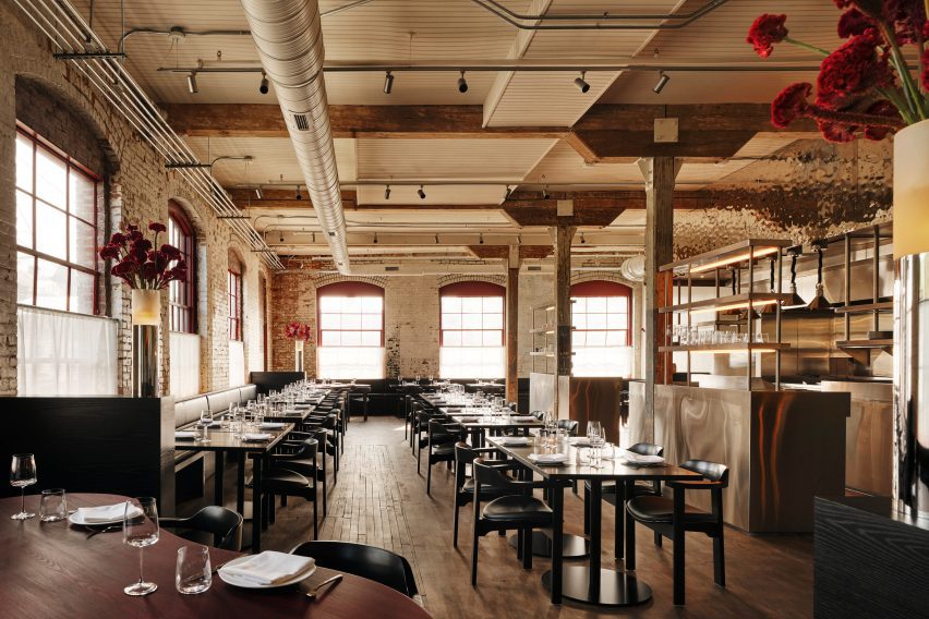 A restaurant decorated with a contemporary take on the industrial aesthetic