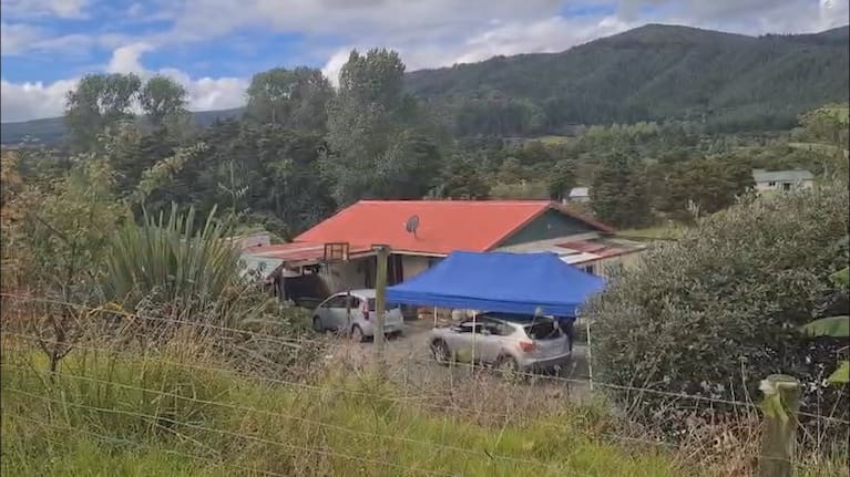 Police examine a property after a woman died in an attack involving three dogs in Kaihū, Northland.
