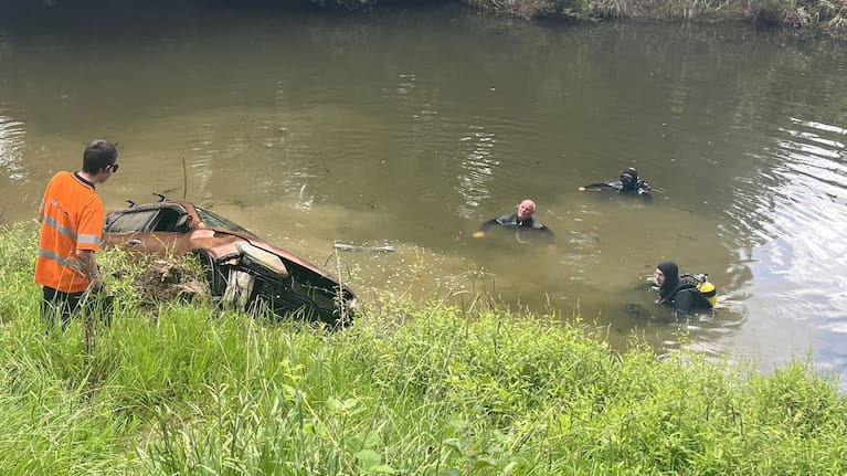Police National Dive Squad members in the Mahurangi River.