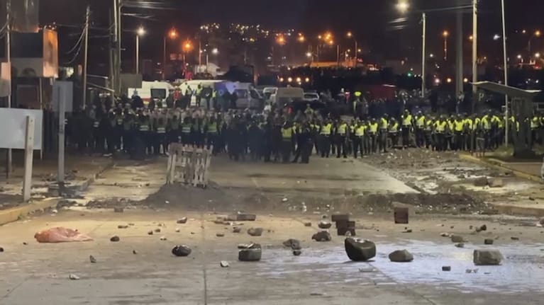 Police used tear gas to disperse people trying to collect the bills scattered from the crashed plane.