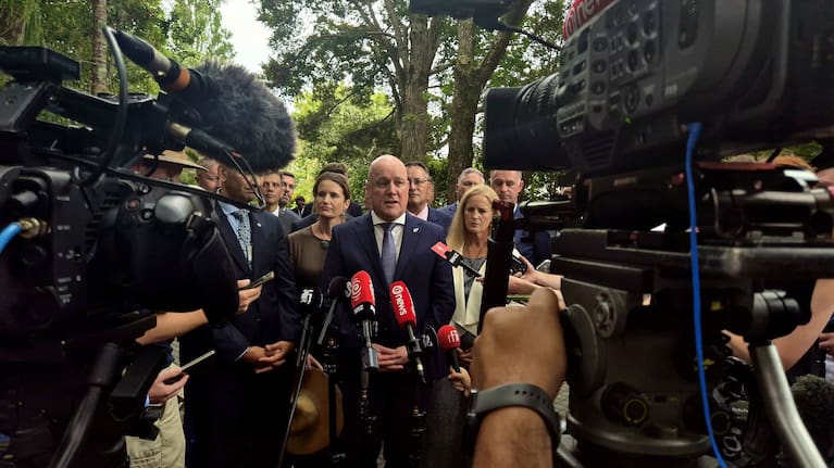 Prime Minister Christopher Luxon and his ministers address reporters at Waitangi.