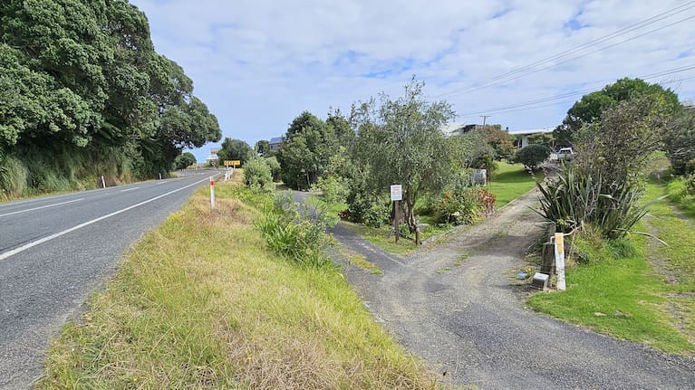 Road barriers stop short of two private properties onto which multiple vehicles have rolled after leaving the highway. (Source: LDR / Diane McCarthy)