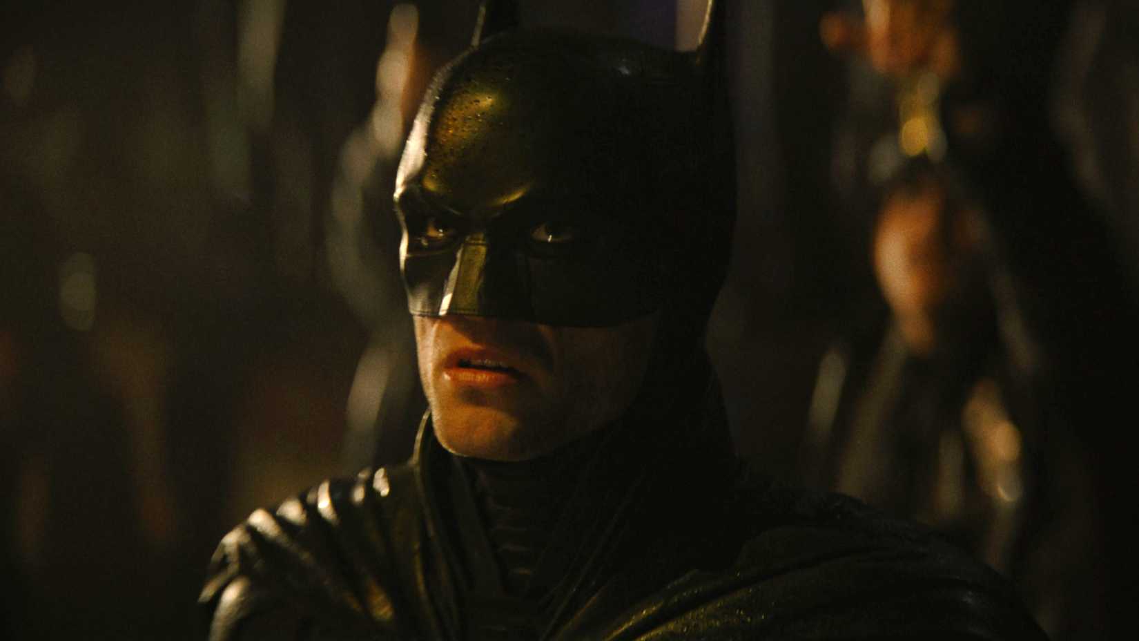 Robert Pattinson's Batman looking scared upwards in The Batman