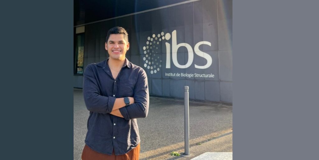 Ronald Ríos Santacruz, Colombian chemist from Universidad del Valle, poses with his Nature paper on vitamin B12 bacterial light sensors.