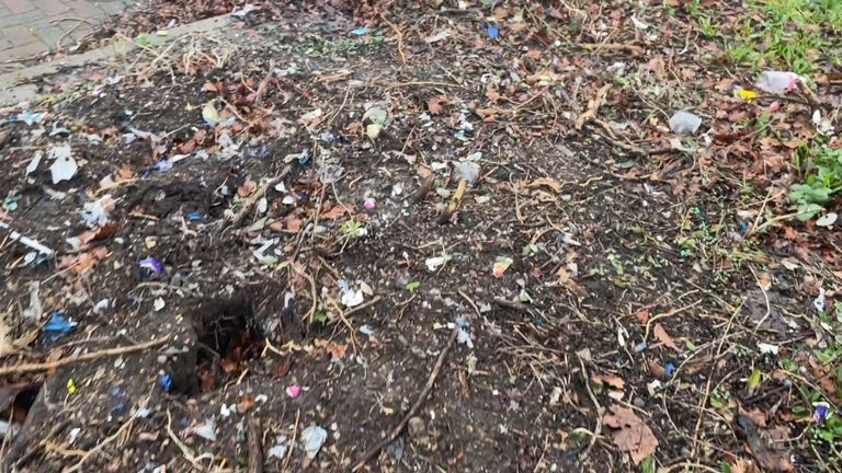 A flowerbed covered in shredded plastic
