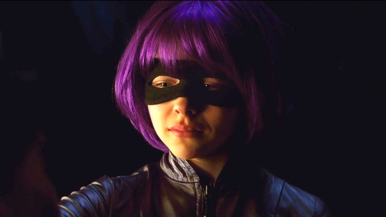 Hit-Girl in Kick-Ass, looking sad in the dark