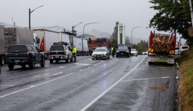Farmer clears path for trapped vehicles with tractor