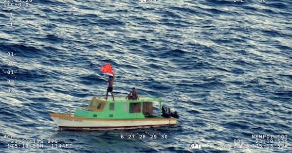 Air Force and Navy rescue men on small boat 200km from Tonga