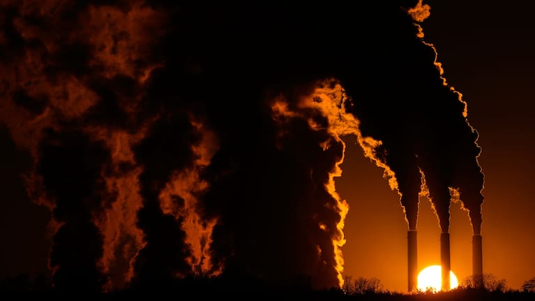 The Jeffrey Energy Center coal-fired power plant operates at sunset near Emmett