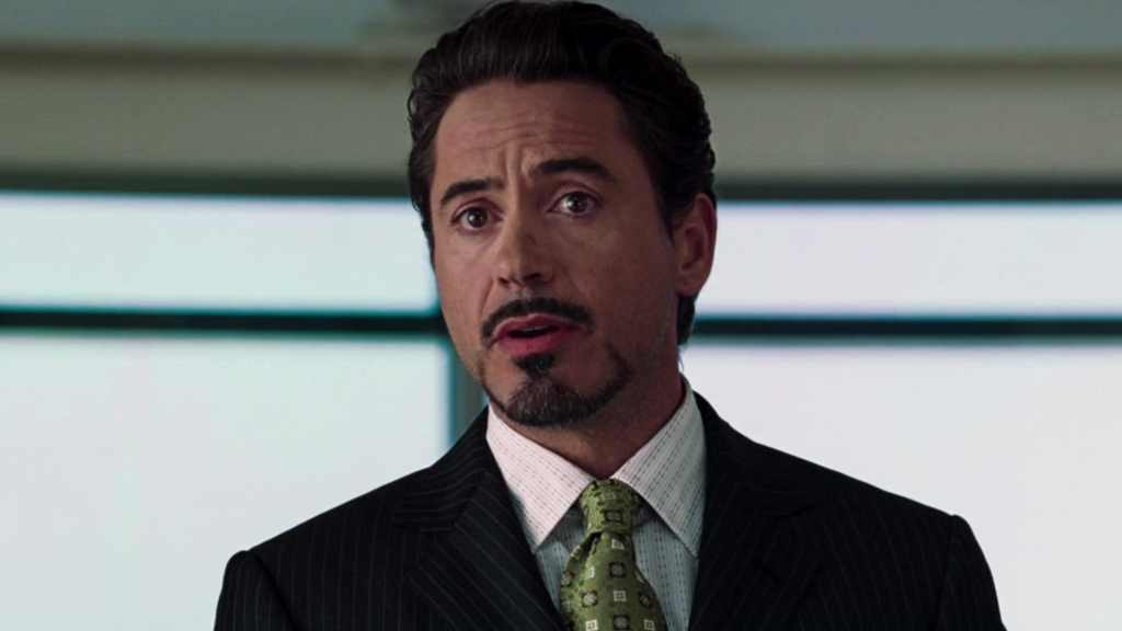 Robert Downey Jr. as Tony Stark giving a speech in Iron Man (2008)