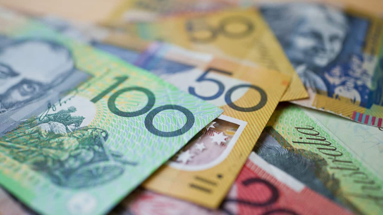 Australian banknotes laid out on a table.