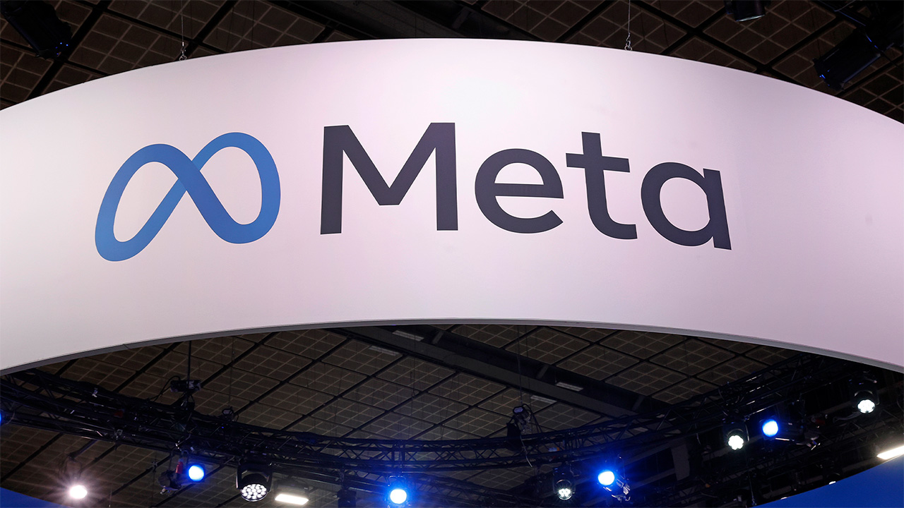 Blue Meta logo, with black Meta text on a white banner