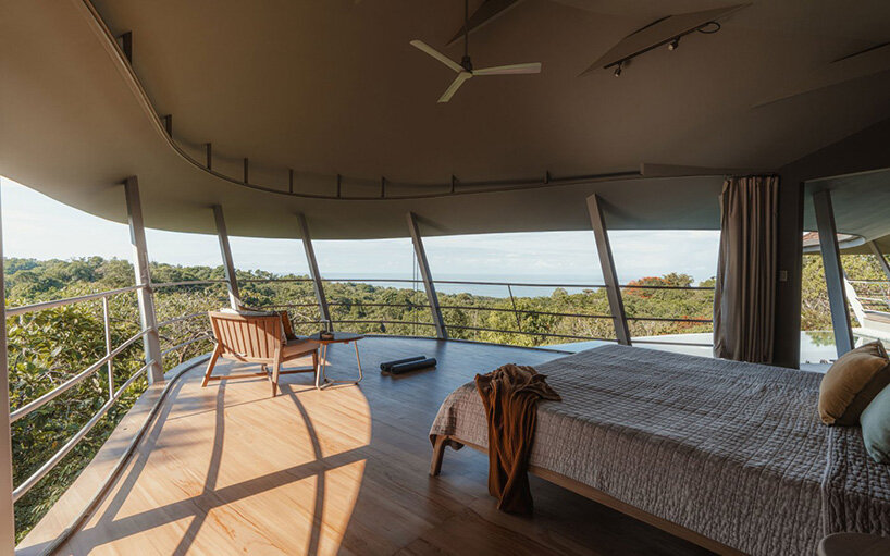 the bedroom opens fully toward the landscape