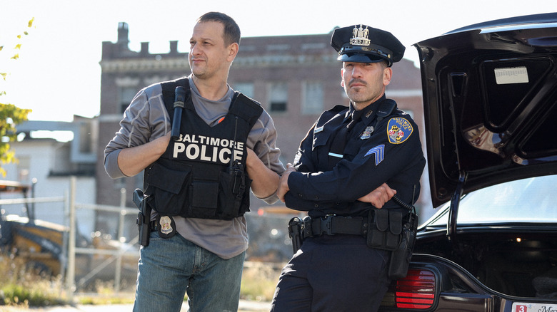 Daniel and Wayne standing by a car in 