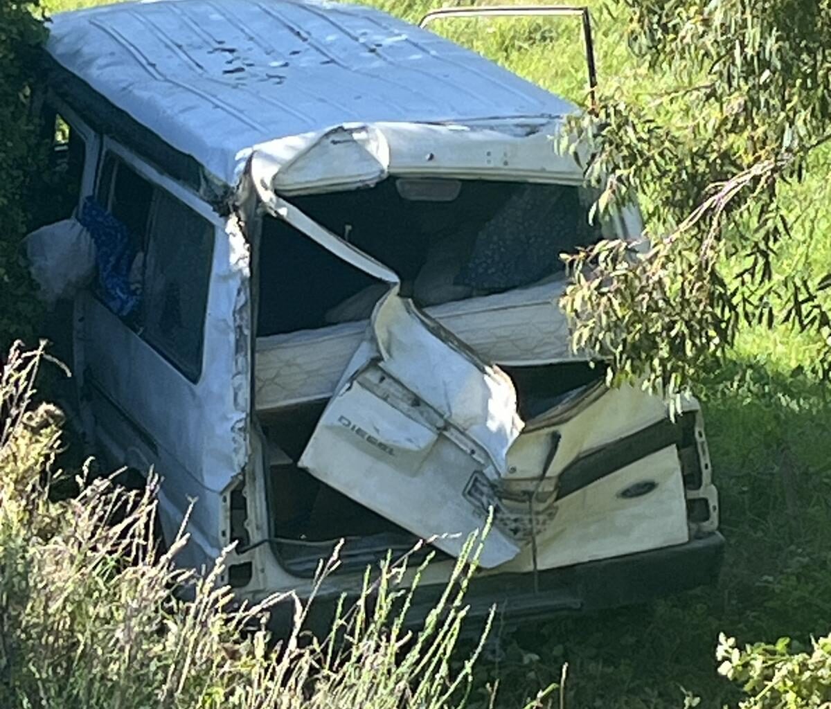 Van owner facing charges after crashing down bank