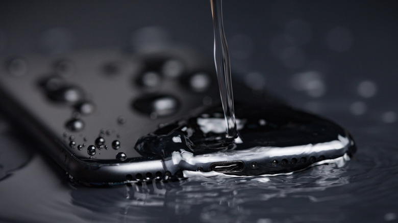 Water being poured on iPhone.