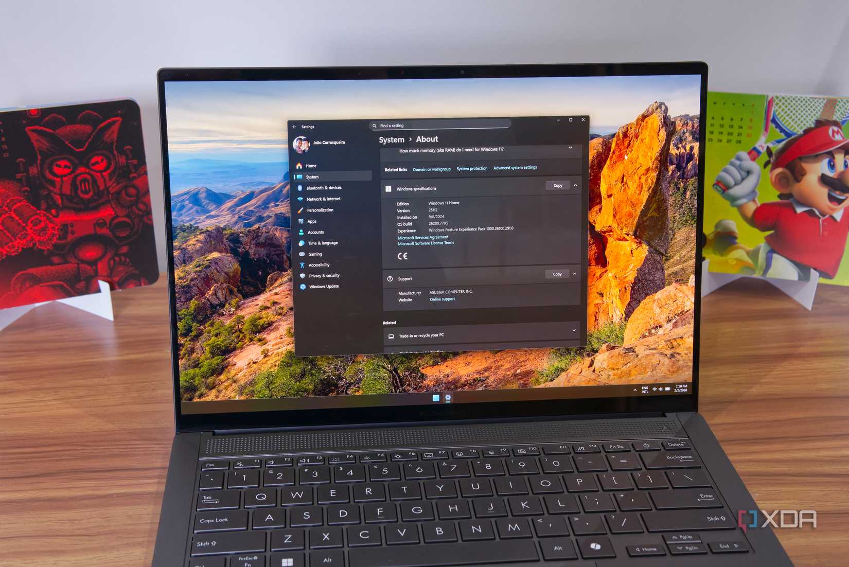 A Windows 11 laptop showing system information in the Settings app