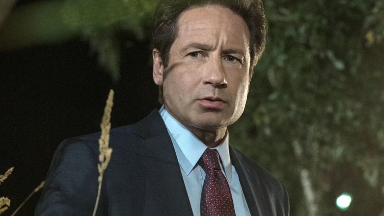 David Duchovny as Agent Fox Mulder looks concerned in The X-Files