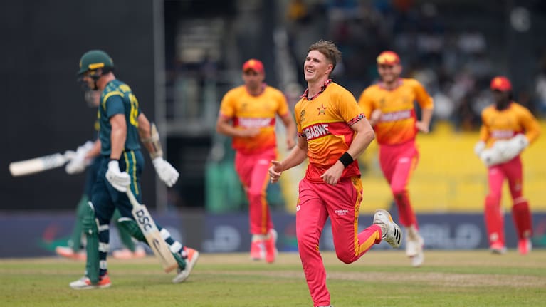Zimbabwe's Bradley Evans, center, celebrates the wicket of Australia's Ben Dwarshuis during the T20 World Cup cricket match between Australia and Zimbabwe in Colombo, Sri Lanka