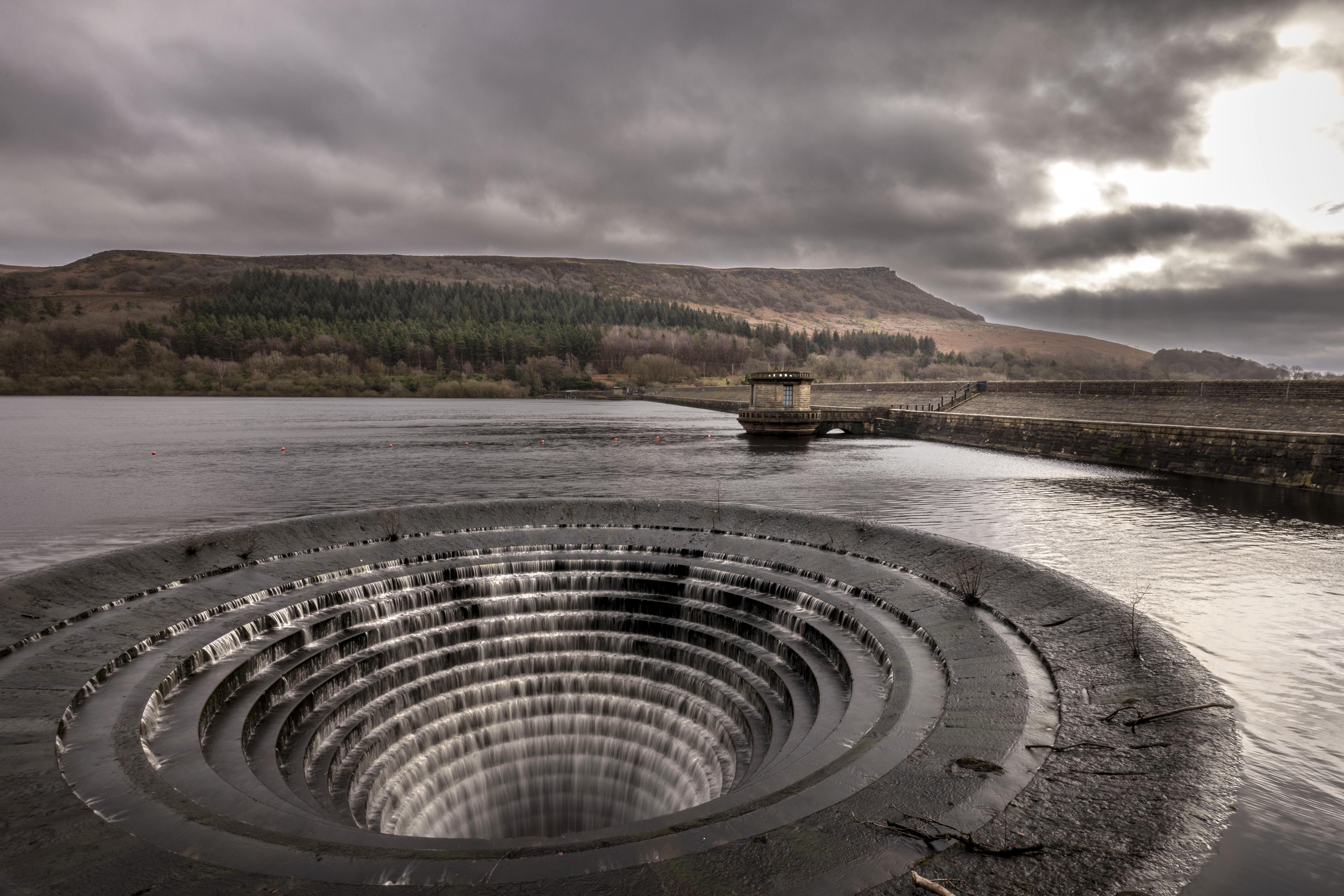 The plughole of Ladybower Reservoir overflowing due to heavy rain.