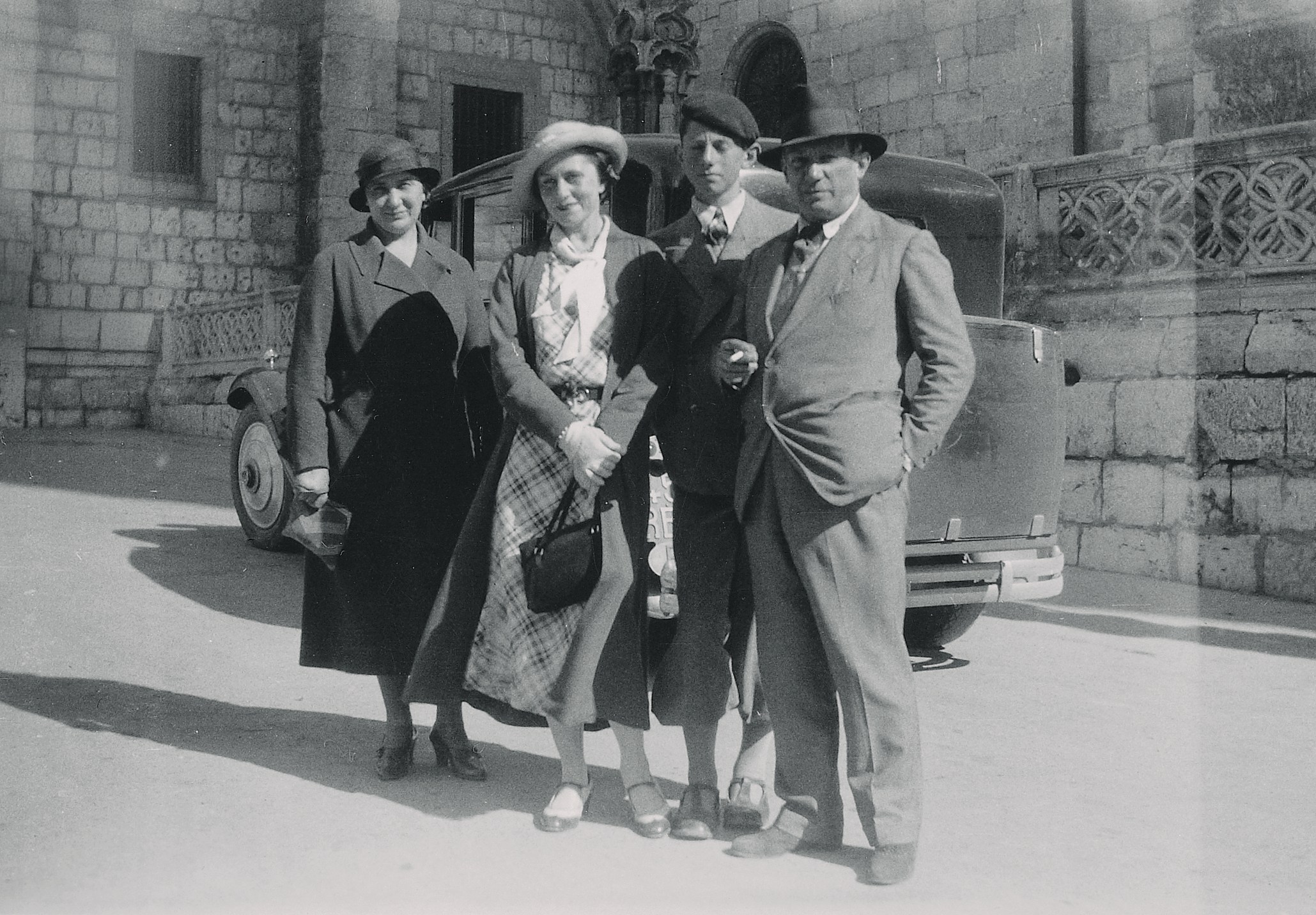 Olga, Paulo, and Pablo Picasso standing in front of Santa Maria Cathedral in Burgos.