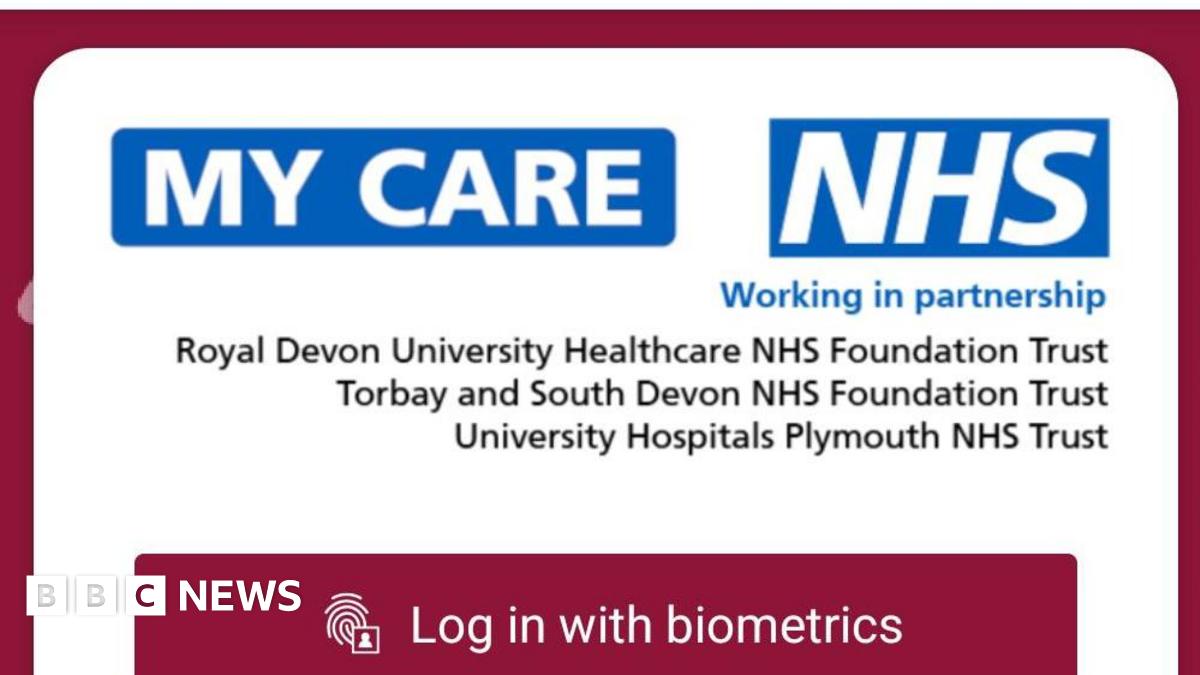 The image shows a screen shot shows the mobile log in page of the new app 'My Care'. It is a red page with white boxes and the blue NHS logo.