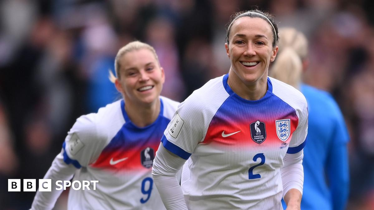A smiling Lucy Bronze celebrates opening the scoring for England