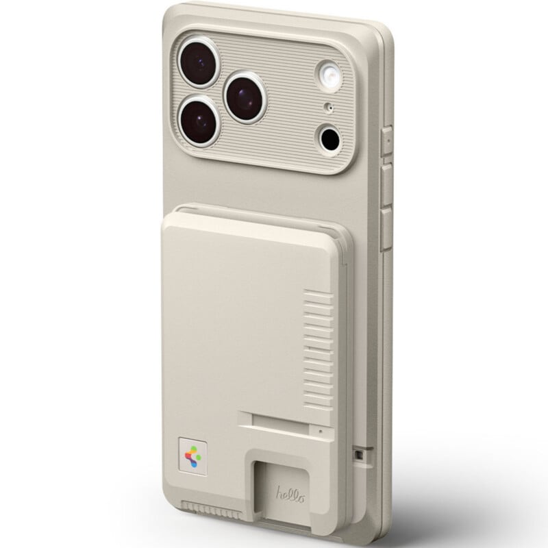 A beige smartphone with a case designed to resemble a retro handheld gaming console, featuring rounded camera lenses and textured details that mimic cartridge slots and ventilation grilles.