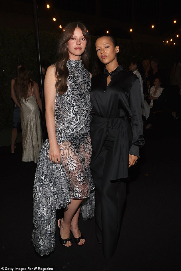 Scream queens Mia Goth and Taylor Russell enjoyed a catch up inside the party