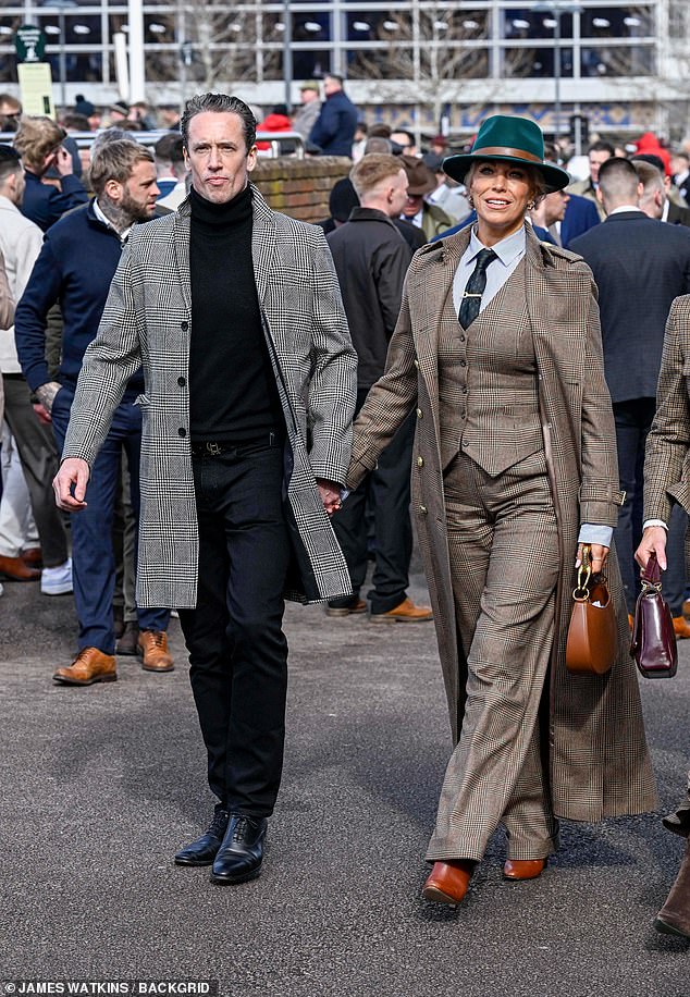 Hannah looked incredibly chic in a Holland Cooper plaid suit as she went matching with Nick