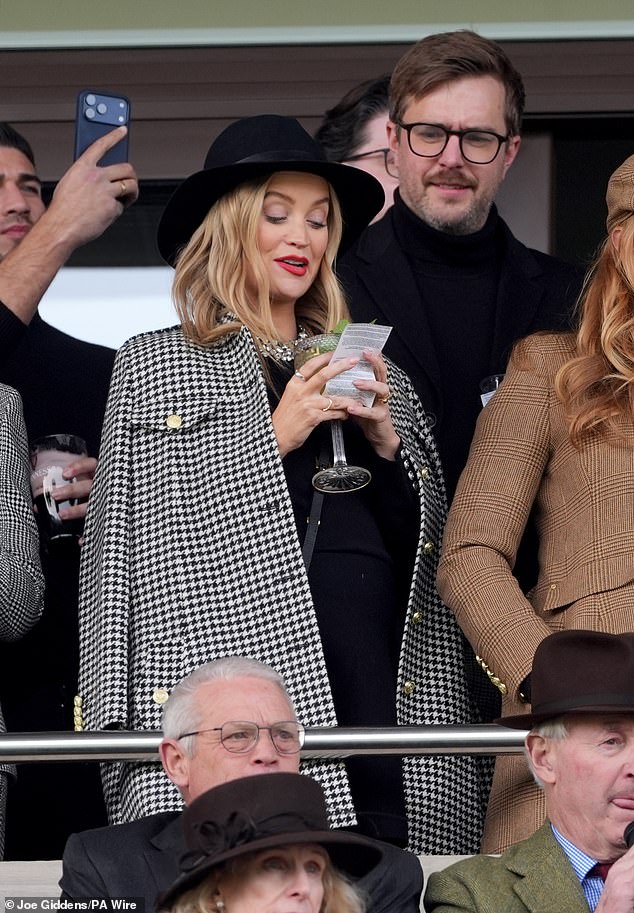Meanwhile TV presenter Laura Whitmore and her husband Ian Stirling were also in attendance as they checked their tickets in the hopes of winning