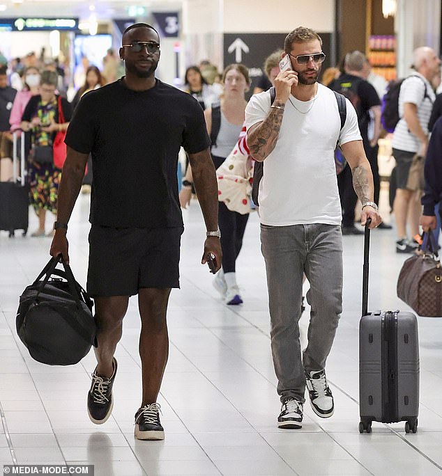 But despite arriving at the airport alongside several of her co-stars - including husband David Momoh (left), Sammy Stanton and Scott McCristal (right) - eagle-eyed fans may notice something curious. Alissa and David appeared careful not to be photographed together