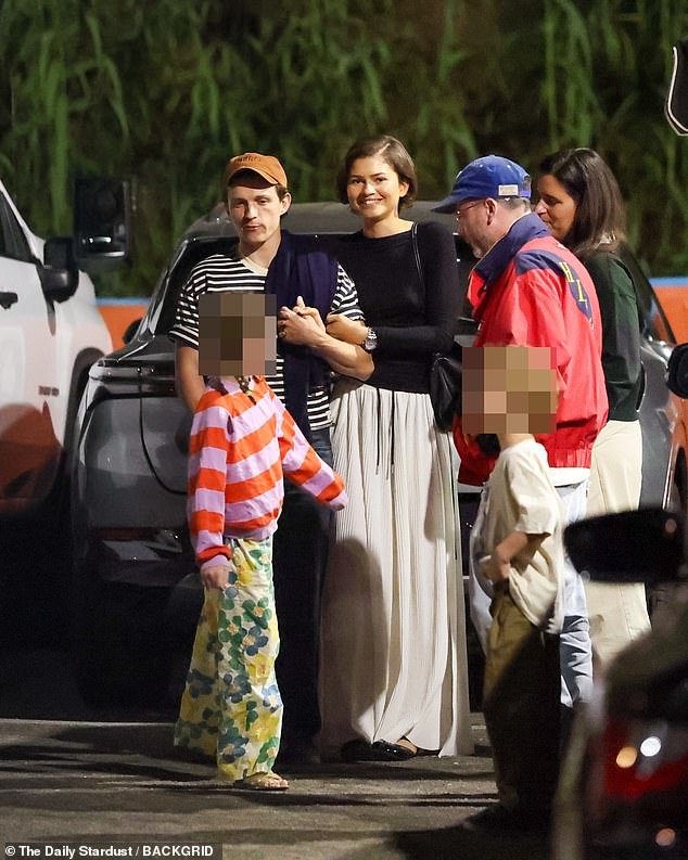 The Euphoria actress was beaming ear to ear as she clasped hands with Holland