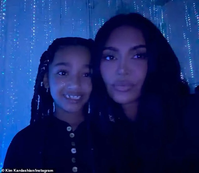 The 45-year-old Skims CCO posed in the faux-rain room with her mini-me, eight-year-old daughter Chicago