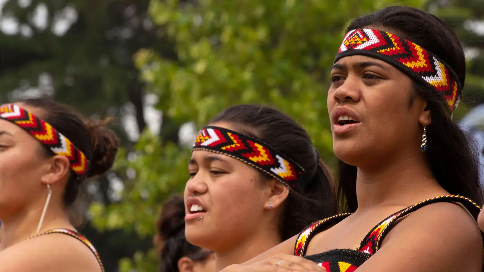 A photo of Māori women dancing in a cultural performance in New Zealand.