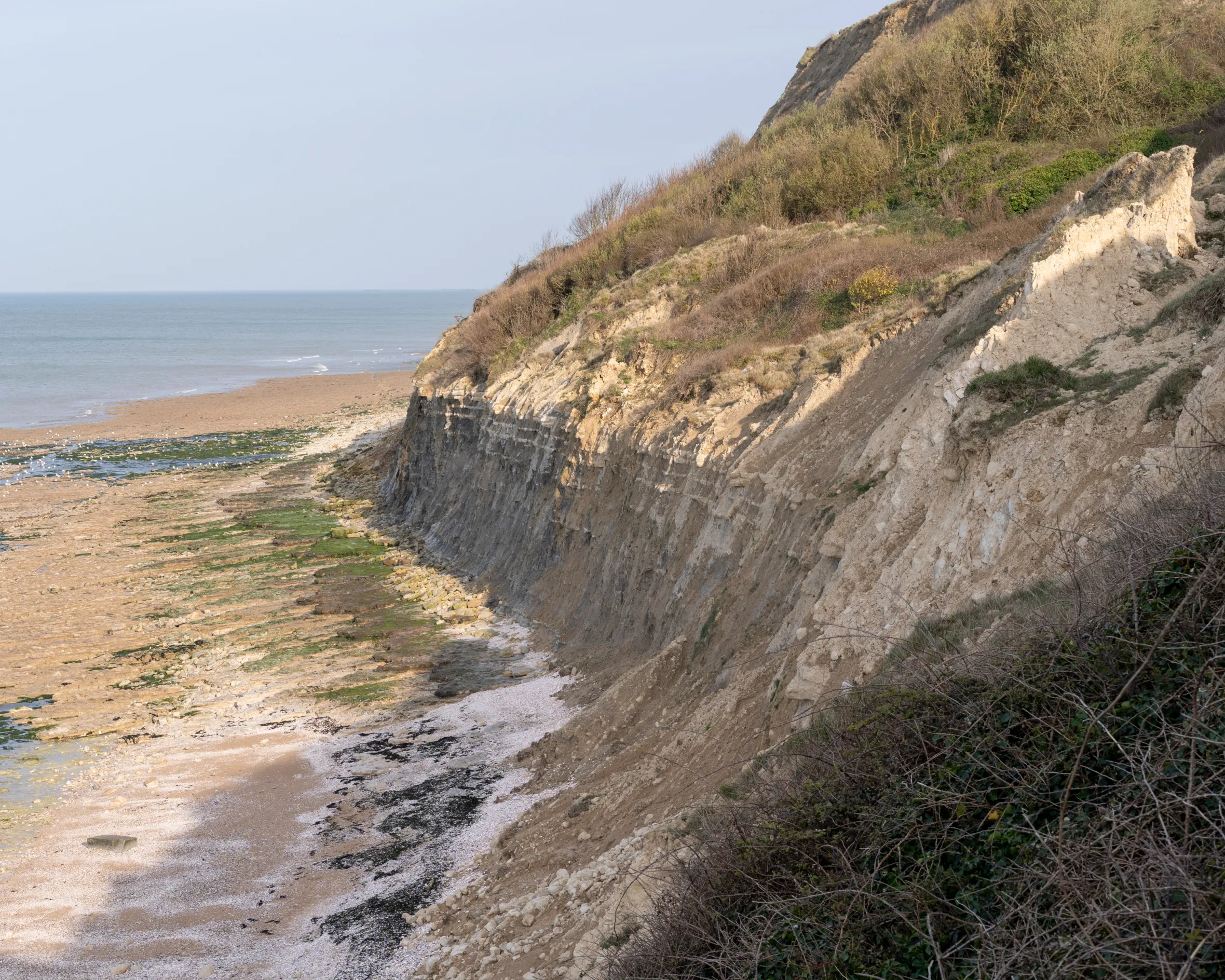 The steep cliffs and beach at Port en Bessin, France.
