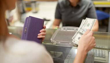 a woman holding cash and her wallet