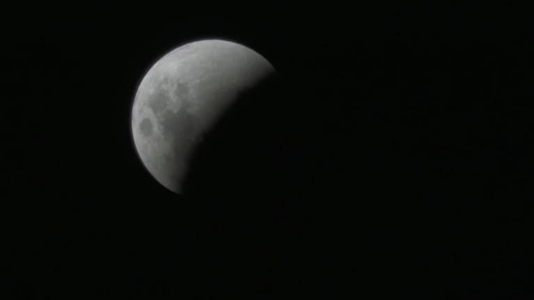A shadow being cast over the moon's surface as seen in Auckland 