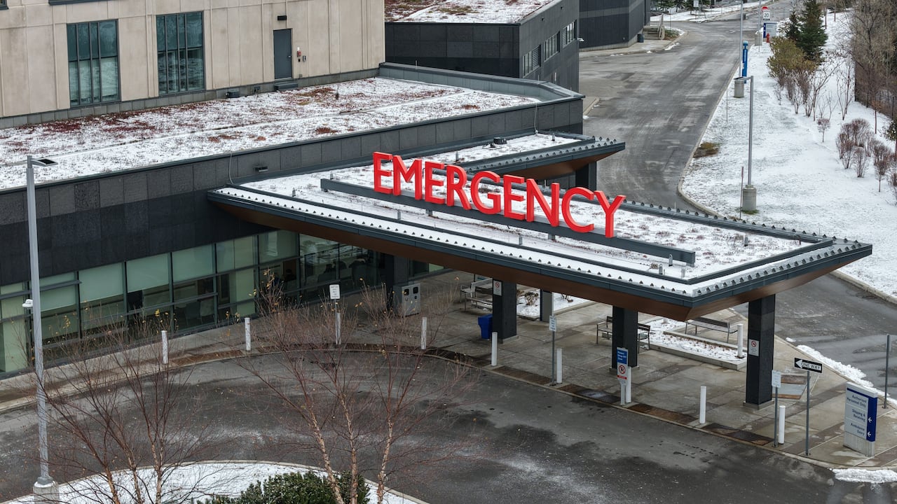 A large sign that says emergency is seen from a drone's view above it.