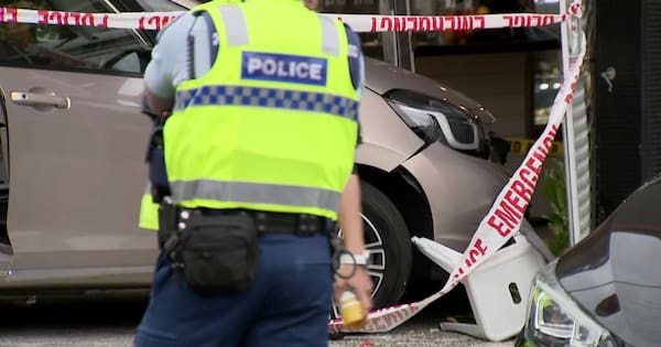 Woman dies after car crashes into cafe on North Shore