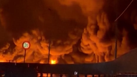 Tehran oil sites on fire as Iran exchanges strikes with Israel and US – video report 